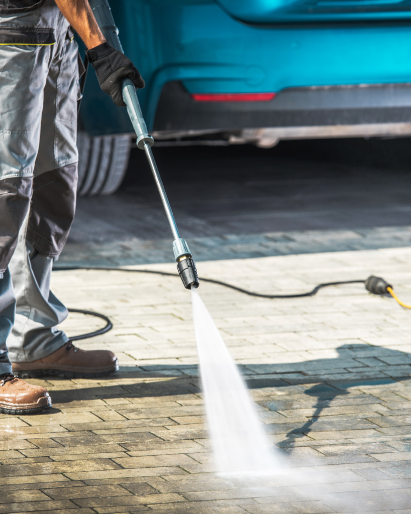 High pressure driveway cleaning in Queensland removing dirt and mould from outdoor paving