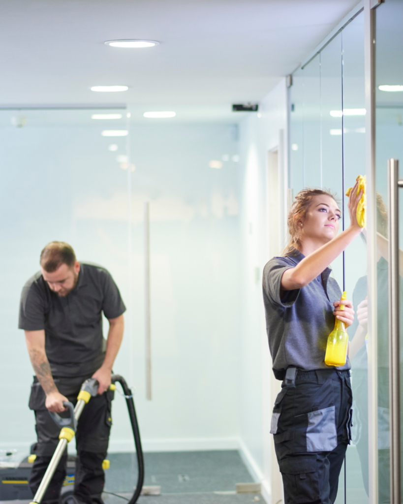 Professional cleaners Queensland providing residential and commercial cleaning services in a glass office